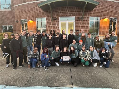 drama students in front of Bob Jones High School