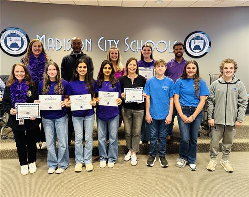 group photo of students holding certificates