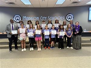 group photo of kids holding certificates