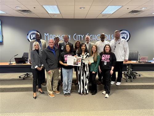 Mrs. Joshi surrounded by board, Journey admins and National Science Club reps holding award