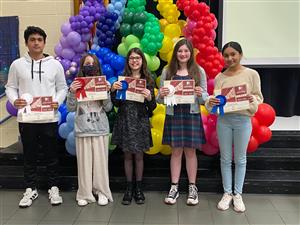 film production winners standing at stage