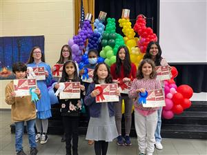 Literature winners standing at stage