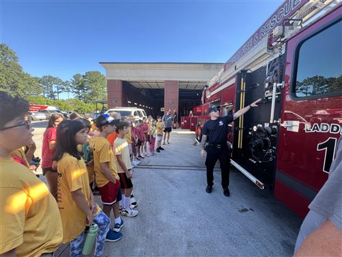 kids beside fire truck