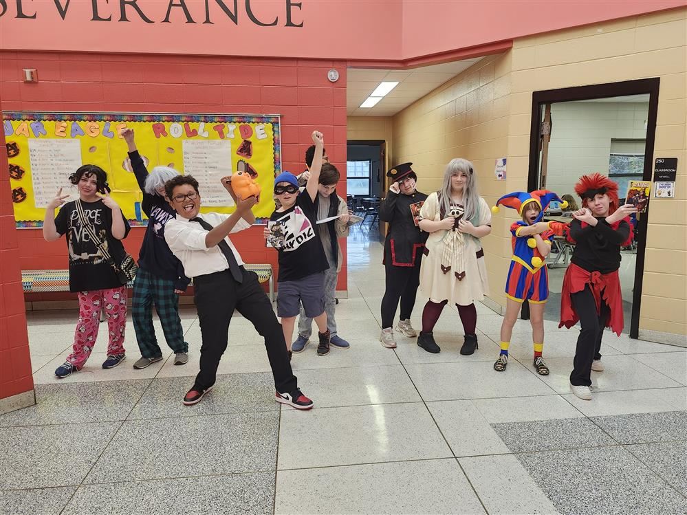 Students posed in different ways dressed in costumes.
