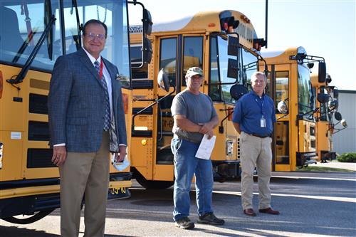 Dr. Nichols, shop foreman Shannon Pease, Transportation Director John Wilson 