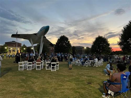 jet in background with beautiful skies at dusk