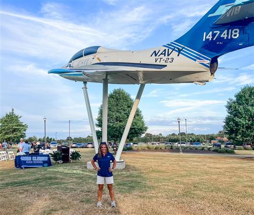 Board member Alice Lessmann with jet in background