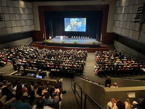 wide angle view of stage with audience in foreground