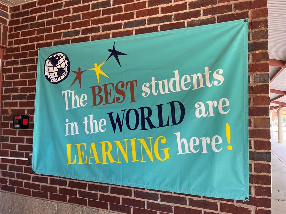  Sign outside school saying the best students are taught here