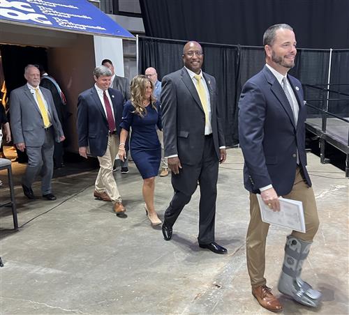 Board members entering graduation ceremonies