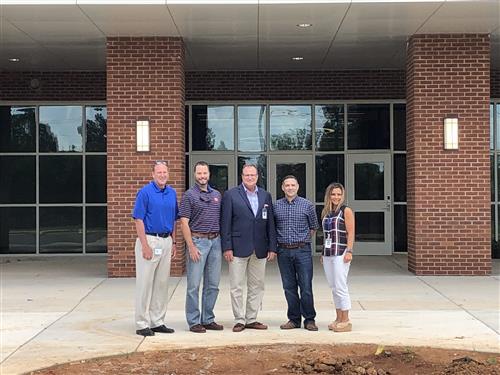 Board members with Dr. Nichols and Mayor Finley at school entrance