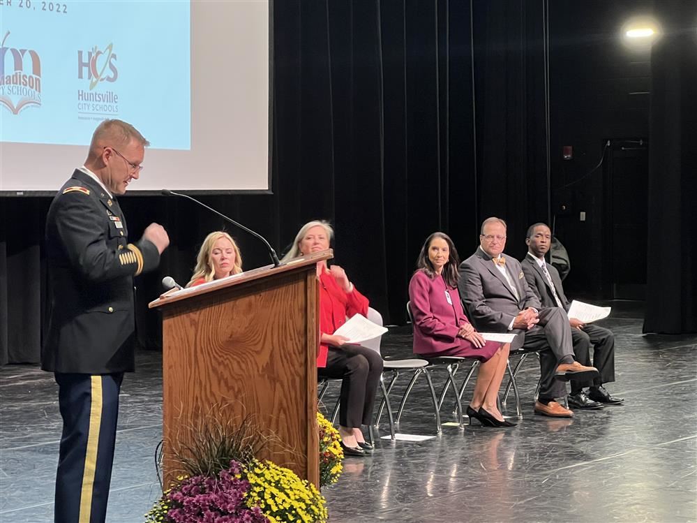  superintendents on stage with Redstone Arsenal Garrisom Commander