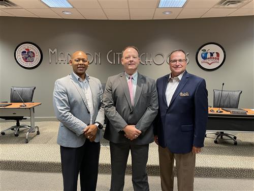 Travis Schrimsher welcomed at board meeting by Supt. Dr. Ed Nichols and Assist. Supt. Eric Terrell