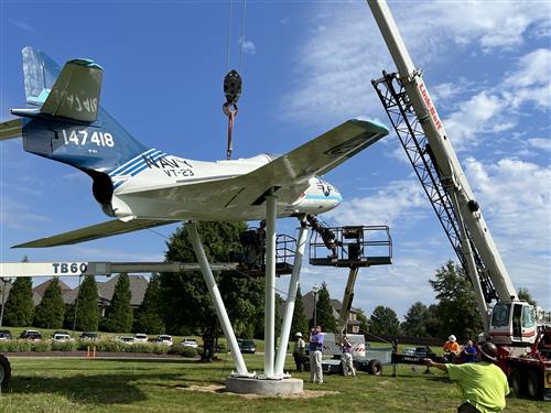 a rear view of aircraft on pedestal