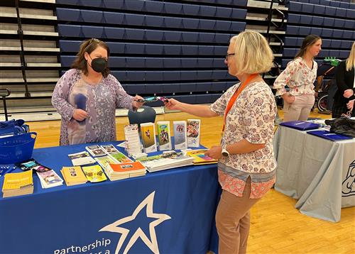 Information tables in the gym filled with pamphlets