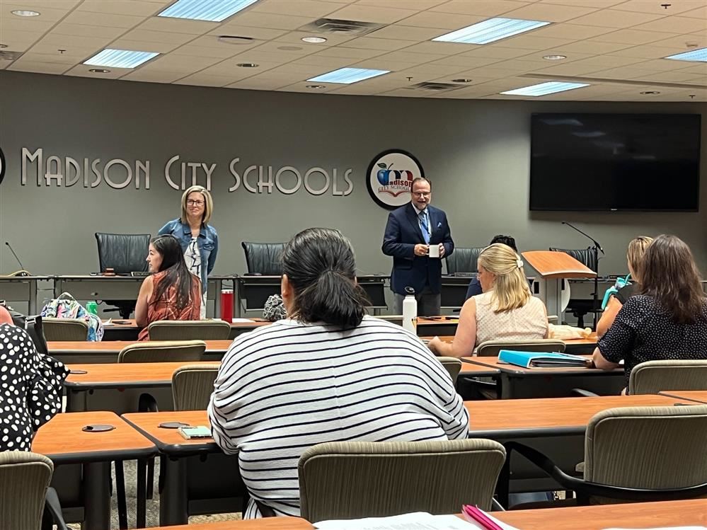  Wide angle photo of Superintendent Dr. Nichols addressing PTA officers in the Board room.