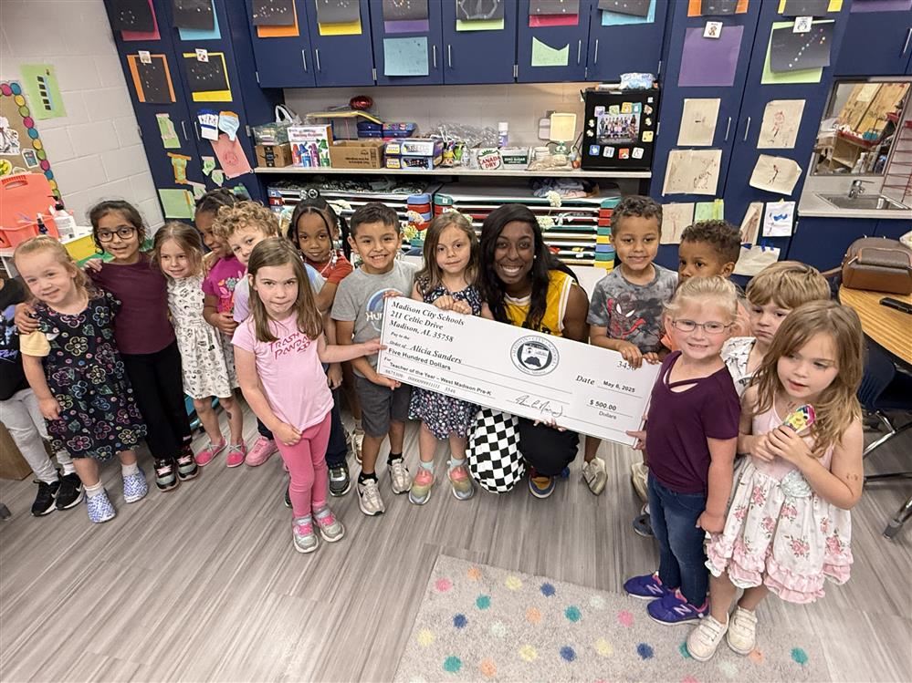  Group pic of students surrounding PreK teacher