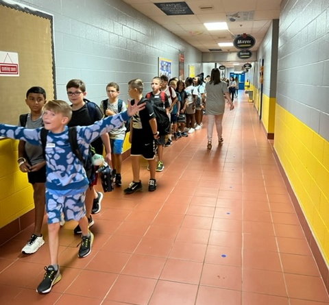 students lined up walking the halls at Heritage Elementary