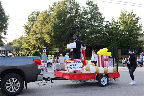 colorful float with signs to beat the Falcons