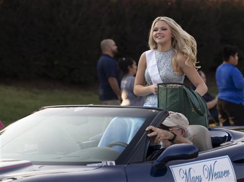 homecoming contestant riding in convertible