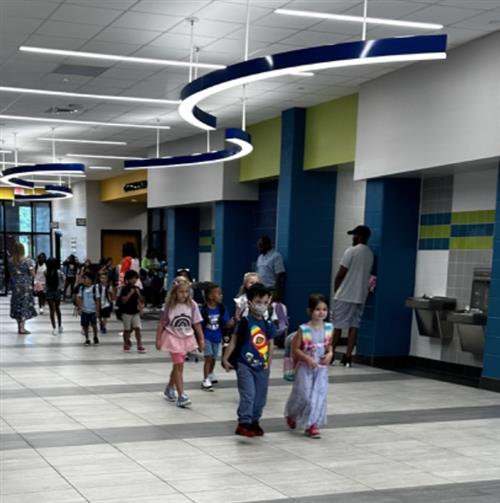 students walking in main hallway at Midtown Elementary