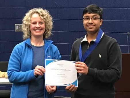 Student receiving Reflections award